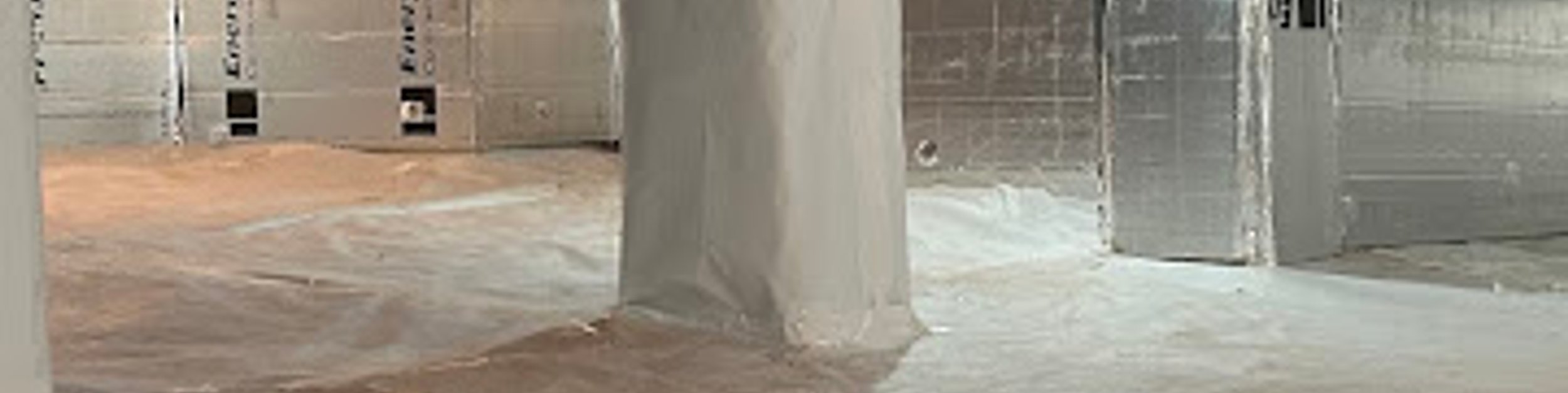 Crawl space pier wrapped in white liner with foil-faced insulation on the walls